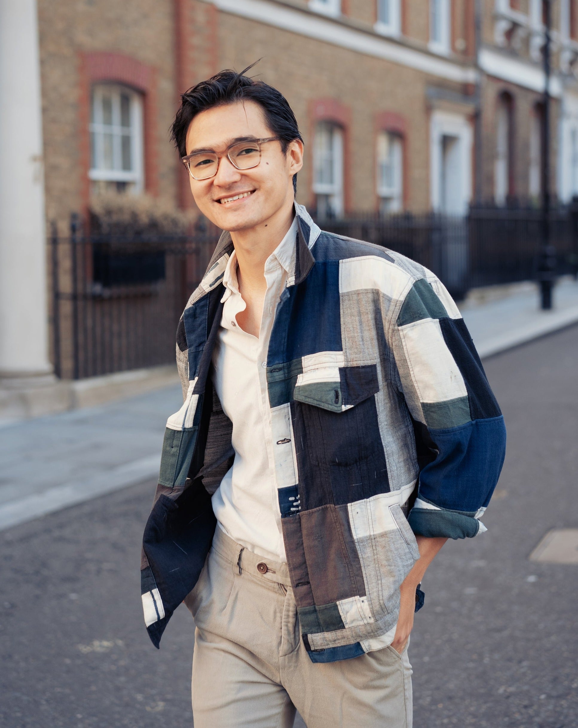 men's wear, men's fashion, denim jacket, man smiling at camera, man walkingg