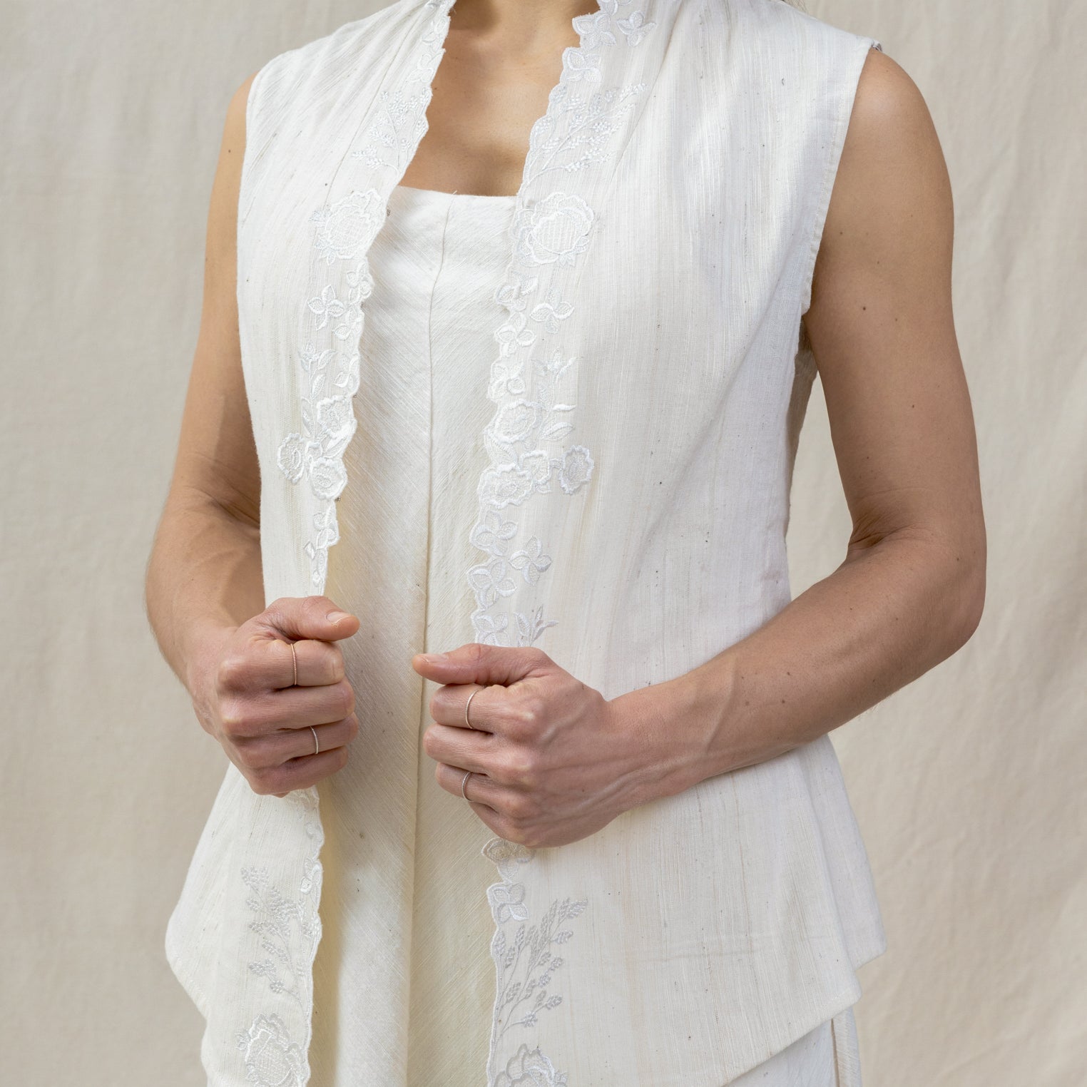 white subtle floral vest from regenerative cotton