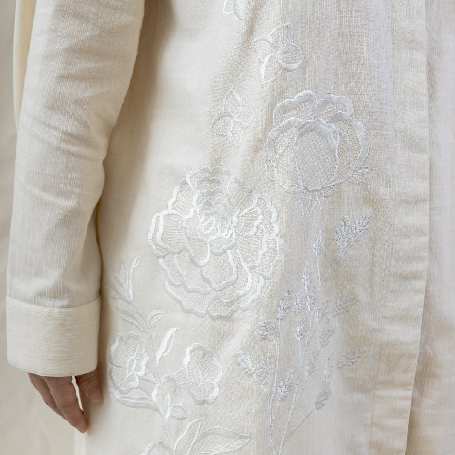 hand-embroidered roses on white regenerative cotton