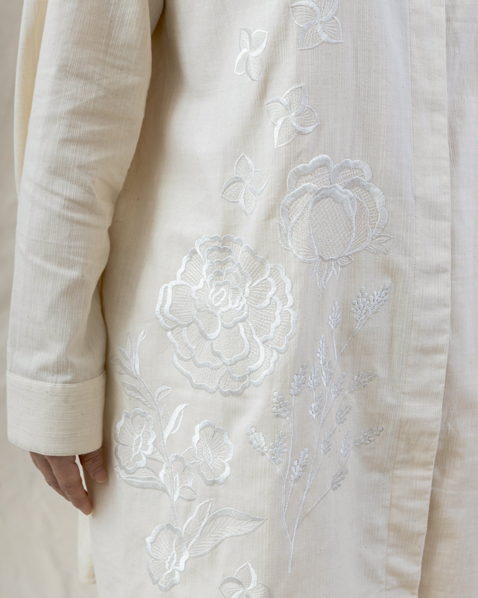 hand-embroidered roses on white regenerative cotton