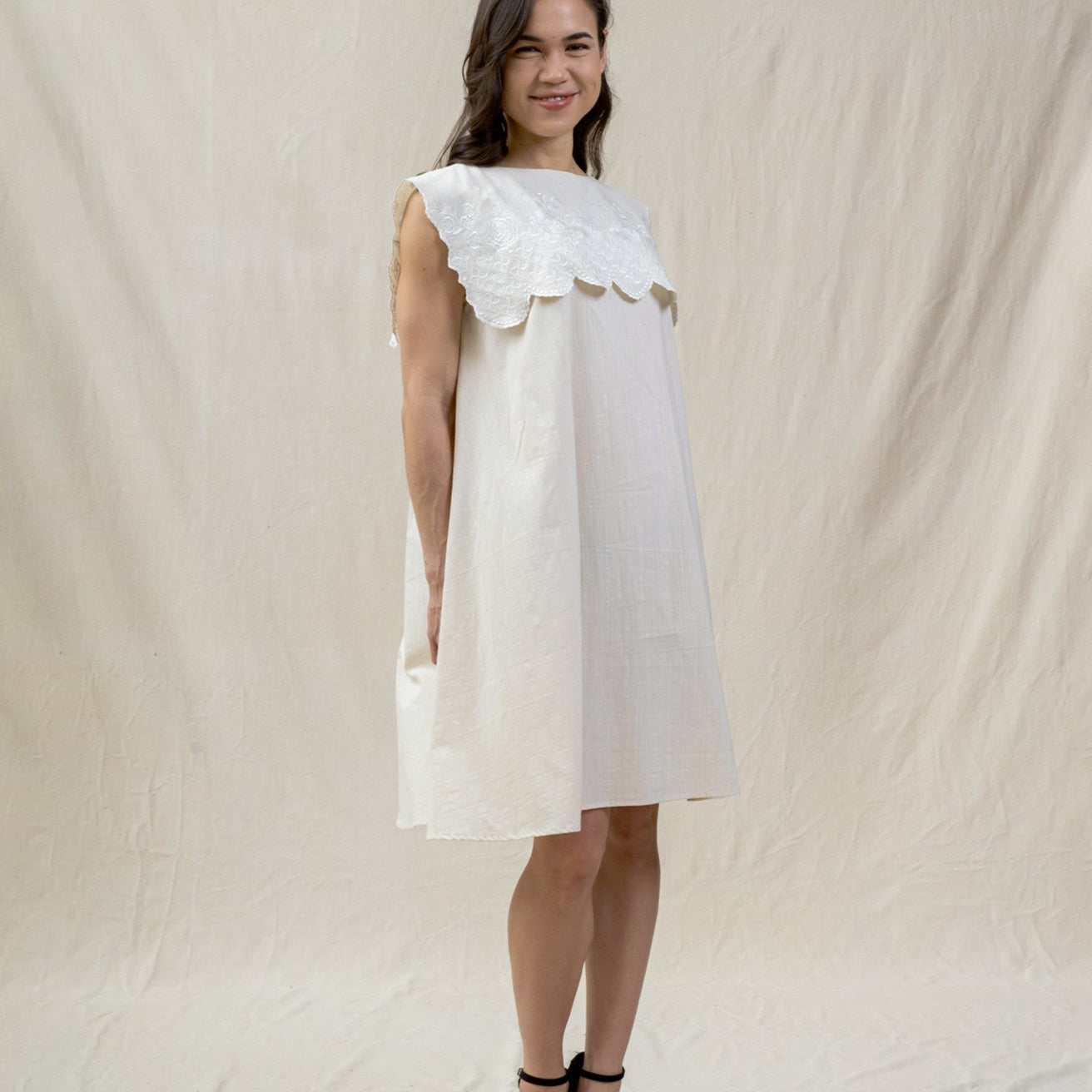 white bib dress from regenerative cotton