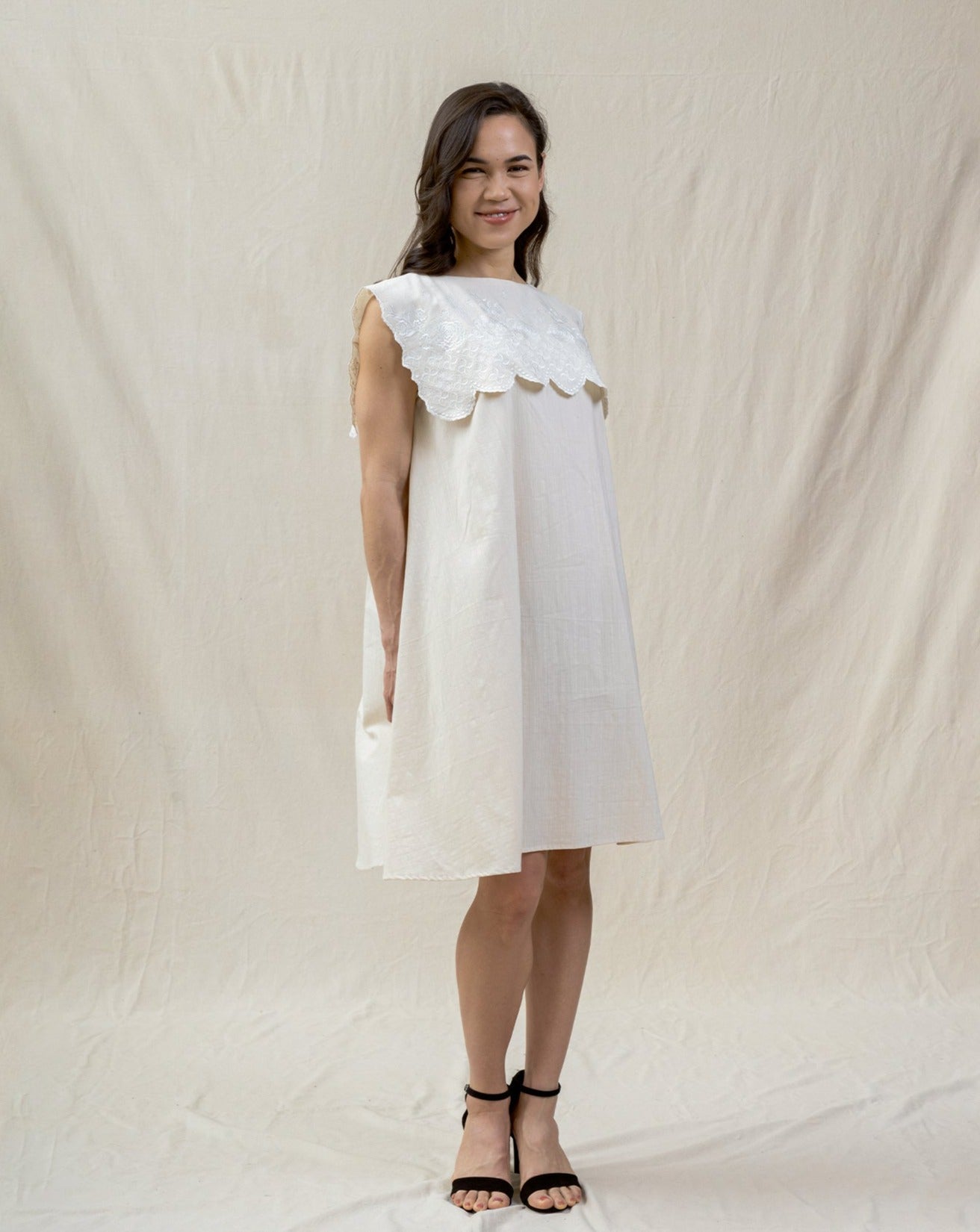 white bib dress from regenerative cotton